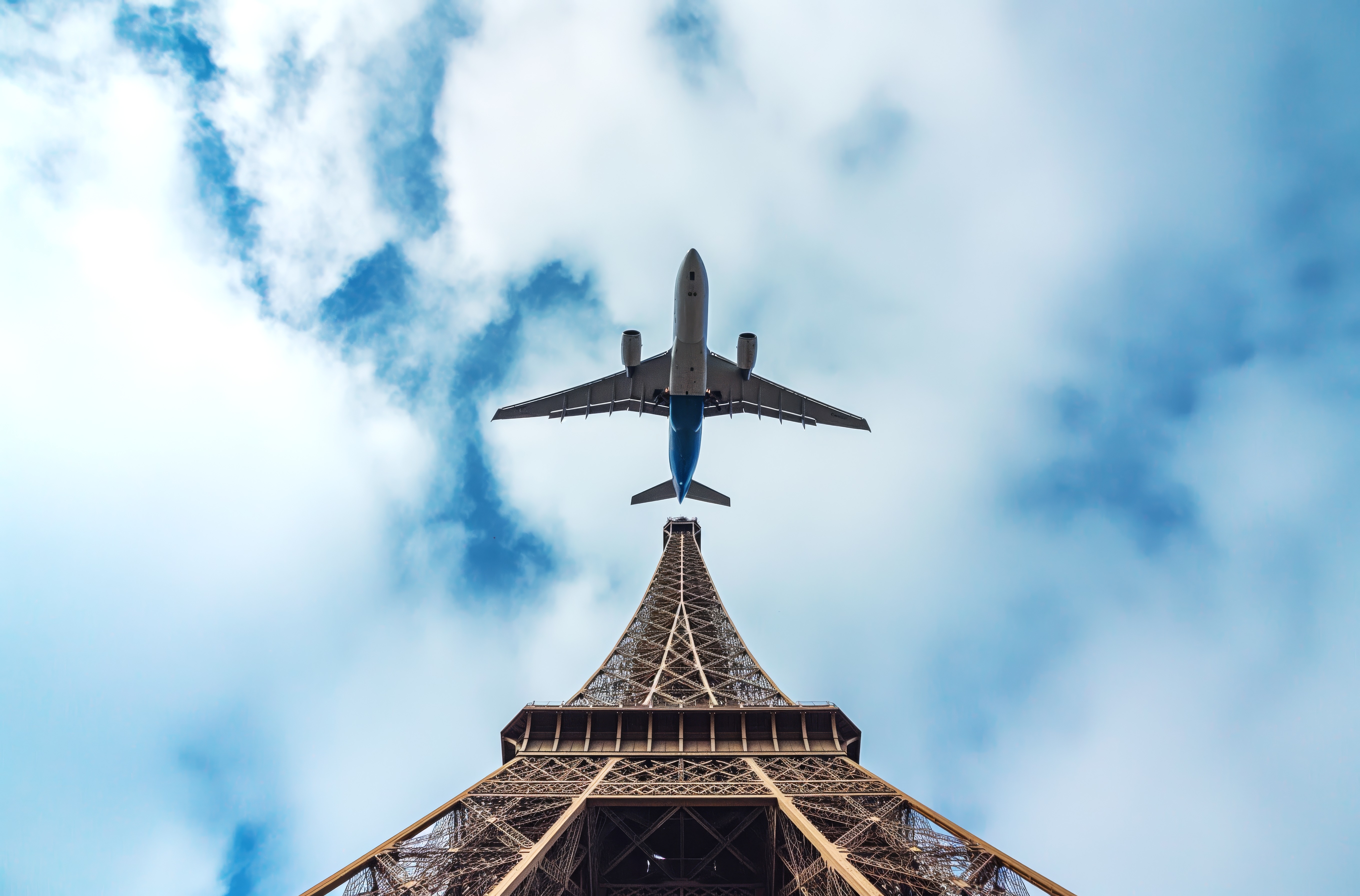 Airplane flying over Eiffel Tower