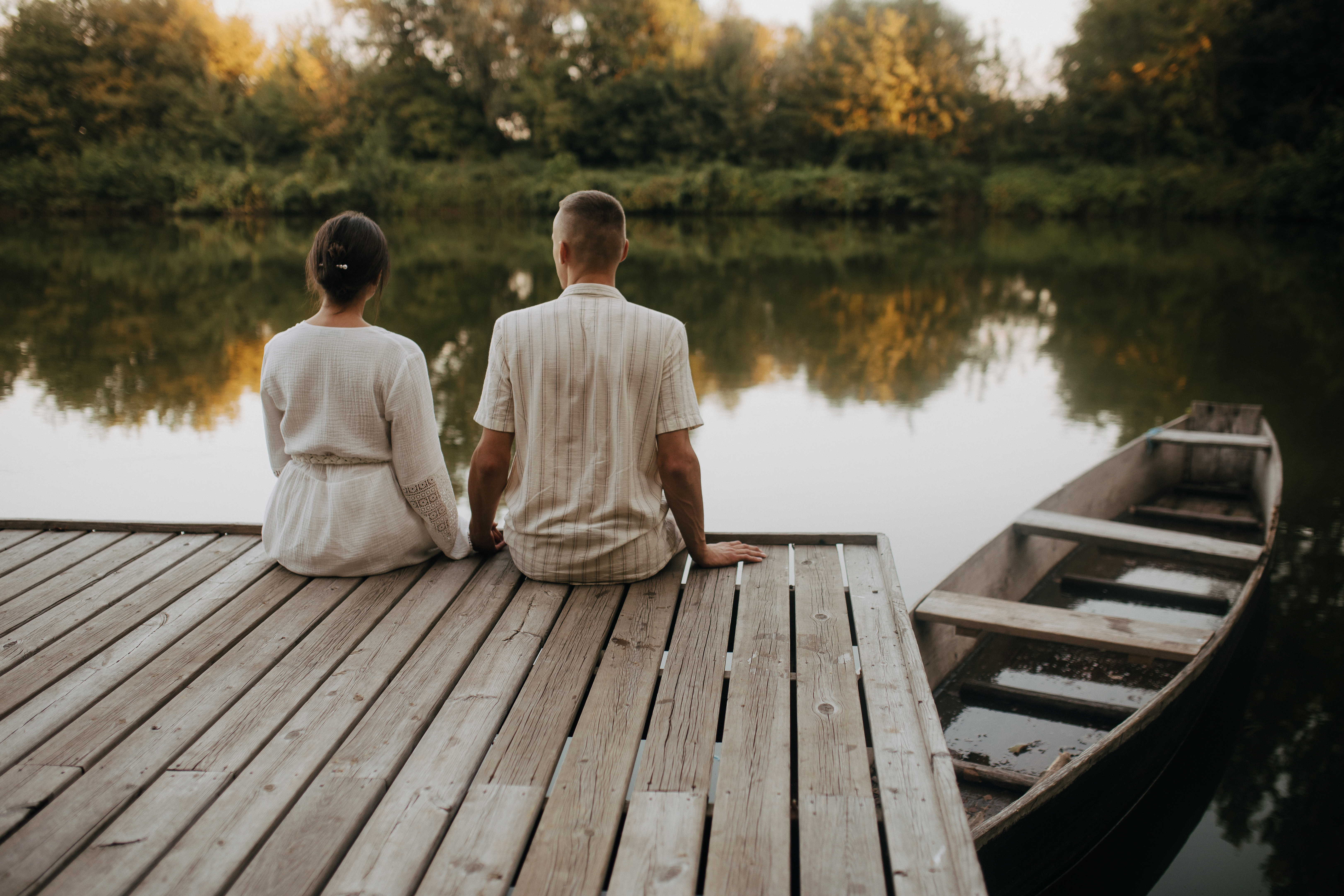 Couple_Sitting_On_A_Pier_original_1865826