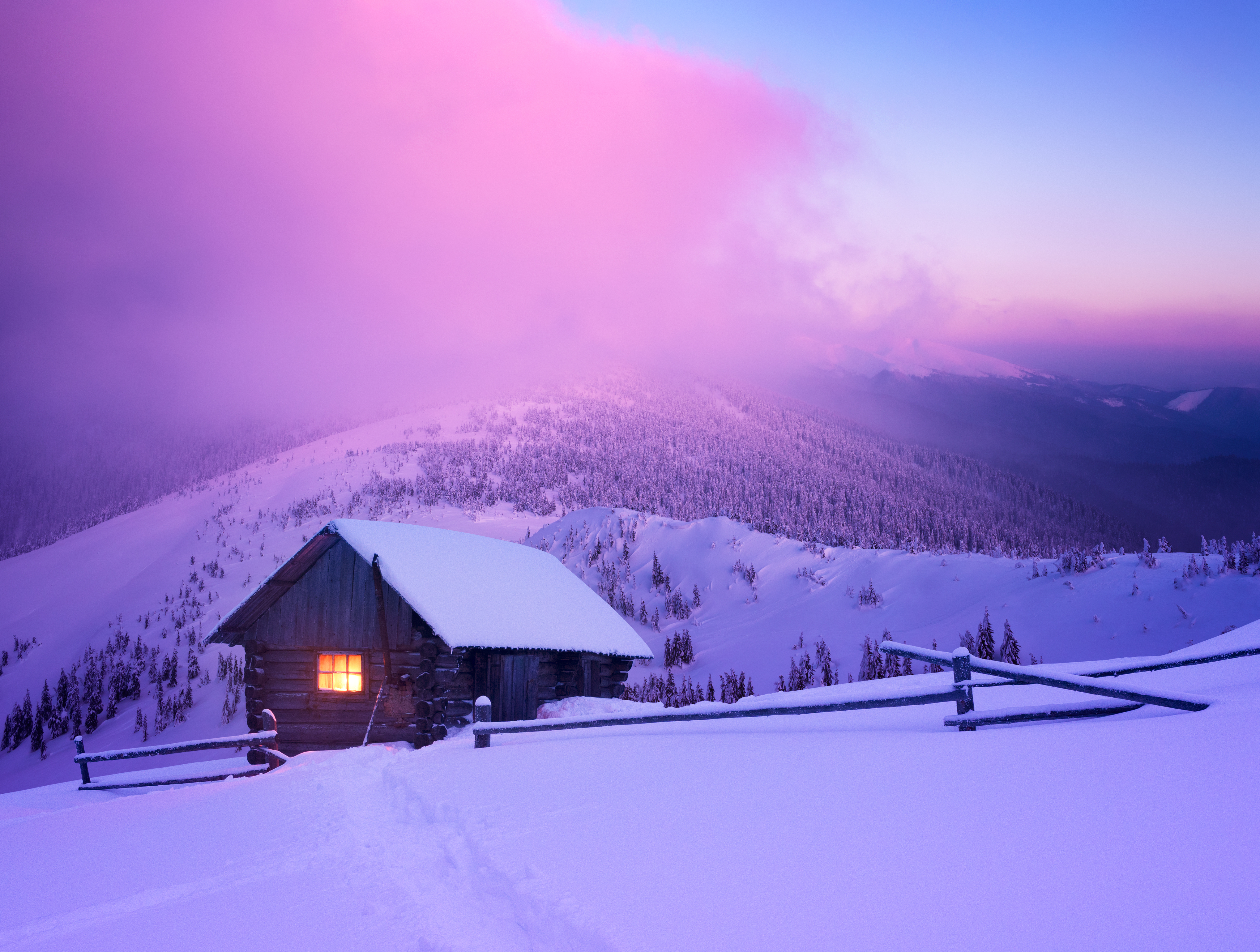Wonderful winter scenery with mountain house in snow